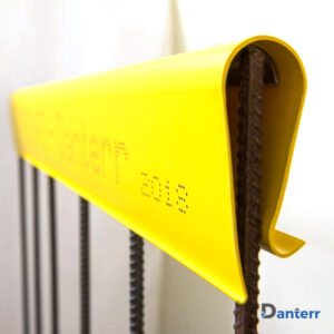 Nevosafe Safety Strip installed on vertical rebar for construction site protection.