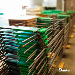 Stacked plate dowel cradles with green spacers for concrete joints