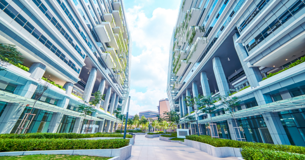 Sustainable commercial buildings with green landscaping and balconies enhancing durability and sustainability
