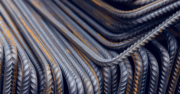 Stack of steel rebar for concrete reinforcement.