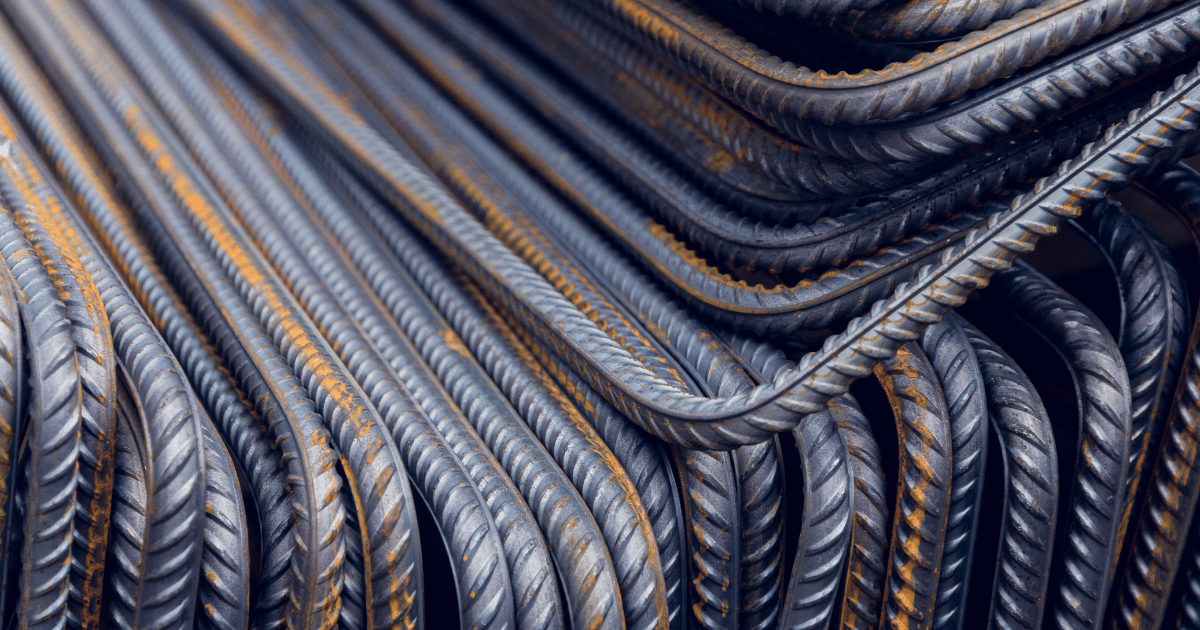 Stack of steel rebar for concrete reinforcement.