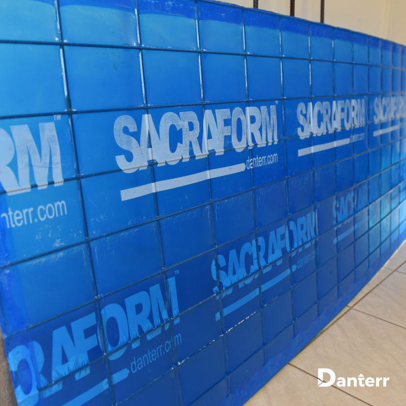 Sacraform™ is a preformed sacrificial formwork system constructed from steel wire mesh with plastic applied to both sides, ensuring robust support for structural elements under slabs.