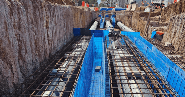 Sacraform sacrificial formwork installed as stay-in-place concrete shutters with reinforcement for structural base.