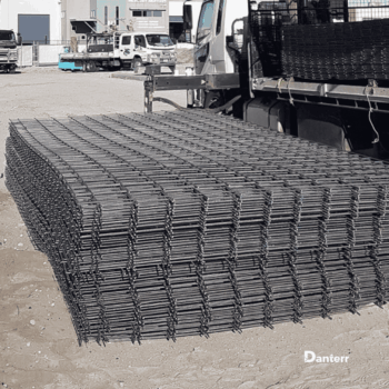 Stainless steel reinforcing mesh stacked on-site for concrete reinforcement and reinforcing steel applications.