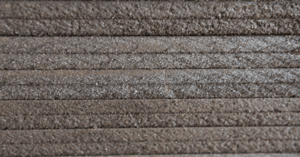 Close-up of Vectorfill™ bitumen impregnated fibre board used as a bitumen board joint filler and expansion joint filler for concrete construction applications.