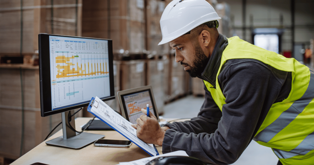 Person checking inventory through computer database