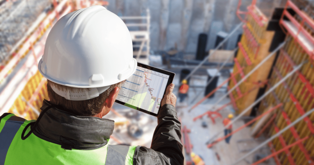 Person performing data analytics on a construction site