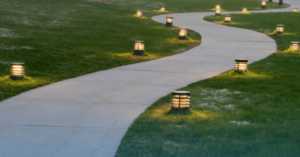Beautifully lit footpath featuring a smooth concrete surface