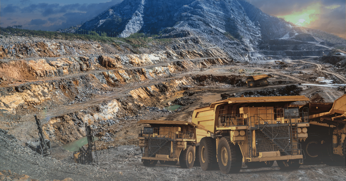 Large mining trucks operating in an open-pit mine in Australia, illustrating the scale of mining jobs and resource extraction.