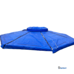 Concrete curing blanket covering a freshly poured foundation slab on a construction site