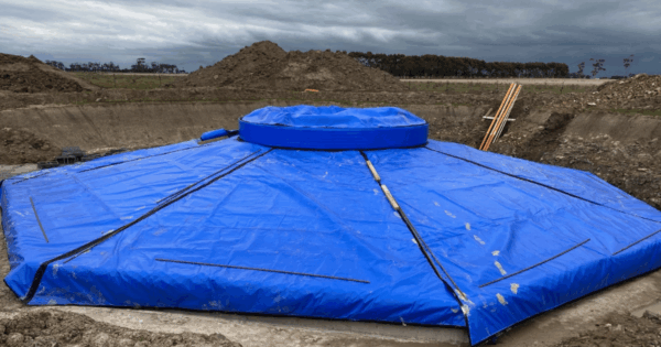 Thermal curing blanket protecting concrete foundation during cold weather construction in Australia