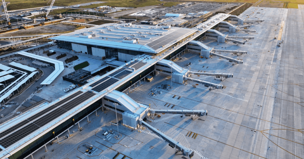 Western Sydney Airport terminal construction site featuring large-scale concrete aprons and terminal structures built with durable reinforcement systems.