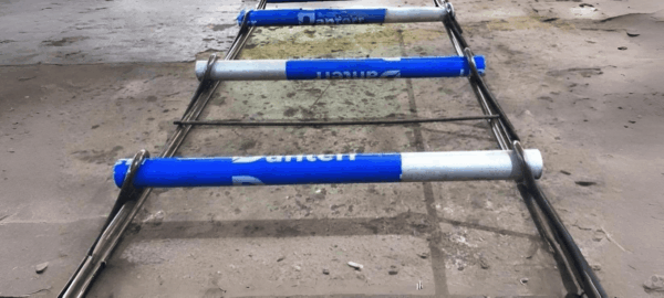Dowel cradle used for load transfer in concrete slab joints on construction site
