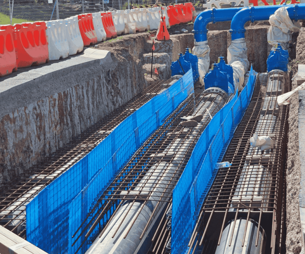 Sacraform™ sacrificial formwork system used as permanent formwork for pipeline reinforcement in trench construction.