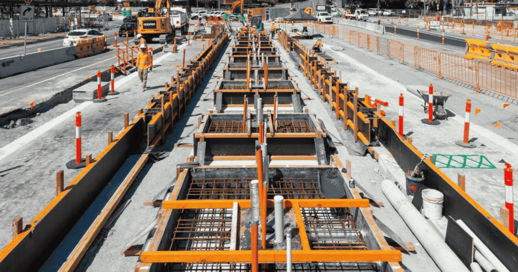 Gold Coast Light Rail Stage 3 construction showing reinforced concrete works with dowel bars and heavy duty pile cage wheels.